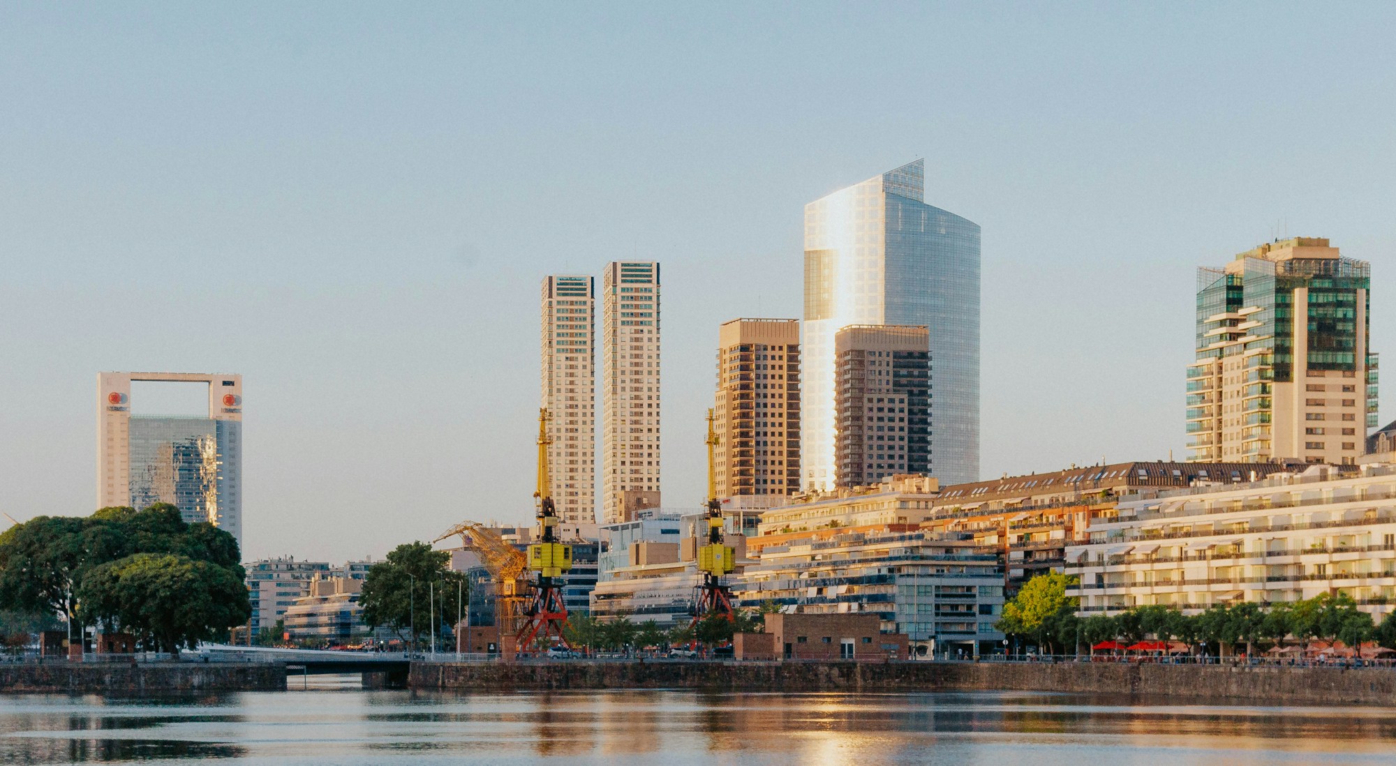 Aerial view of Puerto Madero, Buenos Aires, showing modern residential towers along the river.